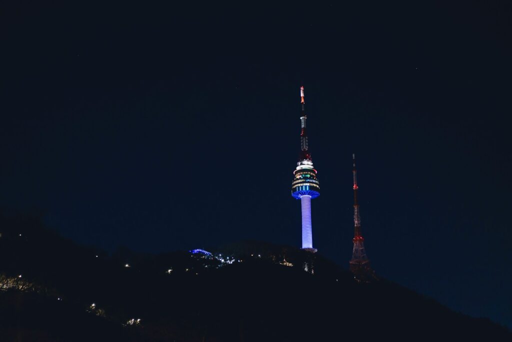 a very tall tower with a sky scraper on top of it