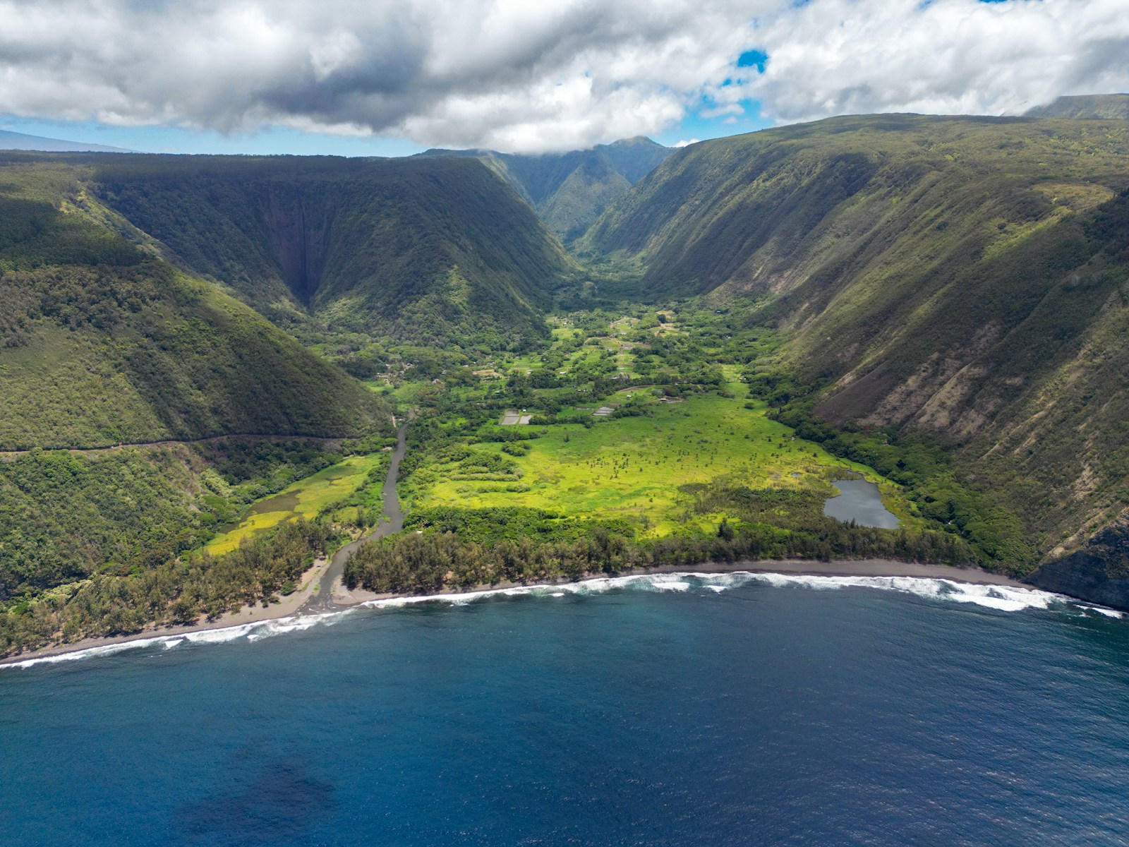 an aerial view of a lush green valley