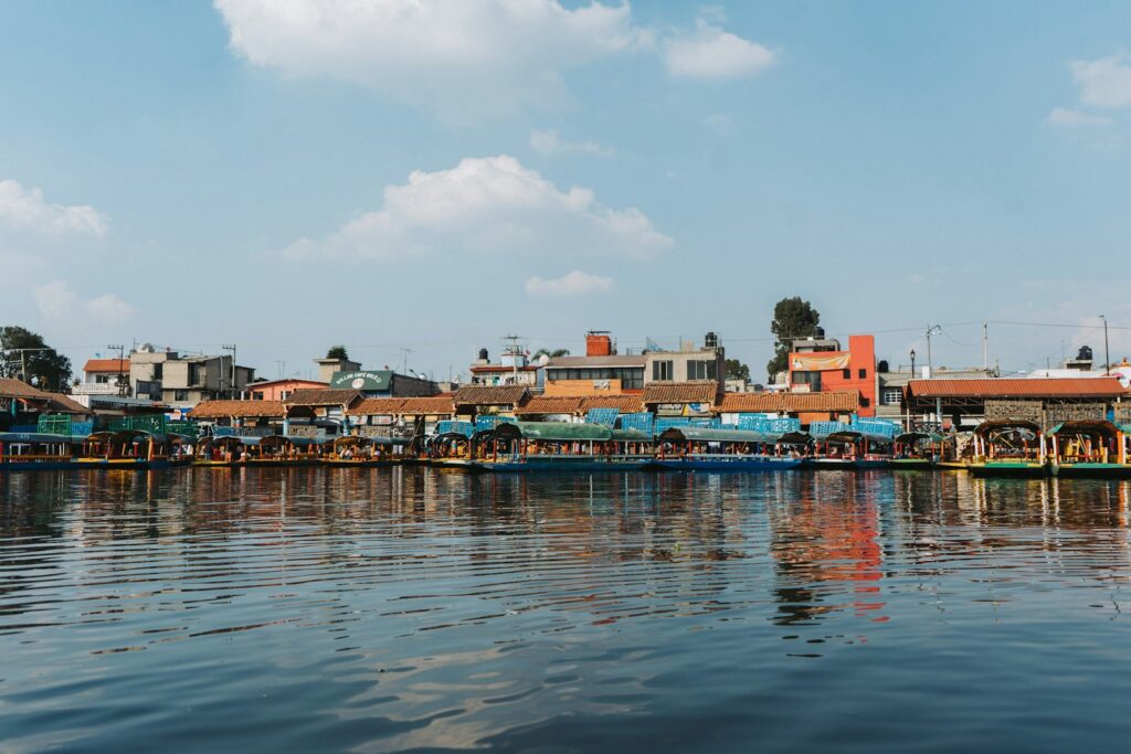 A body of water with a bunch of houses in the background