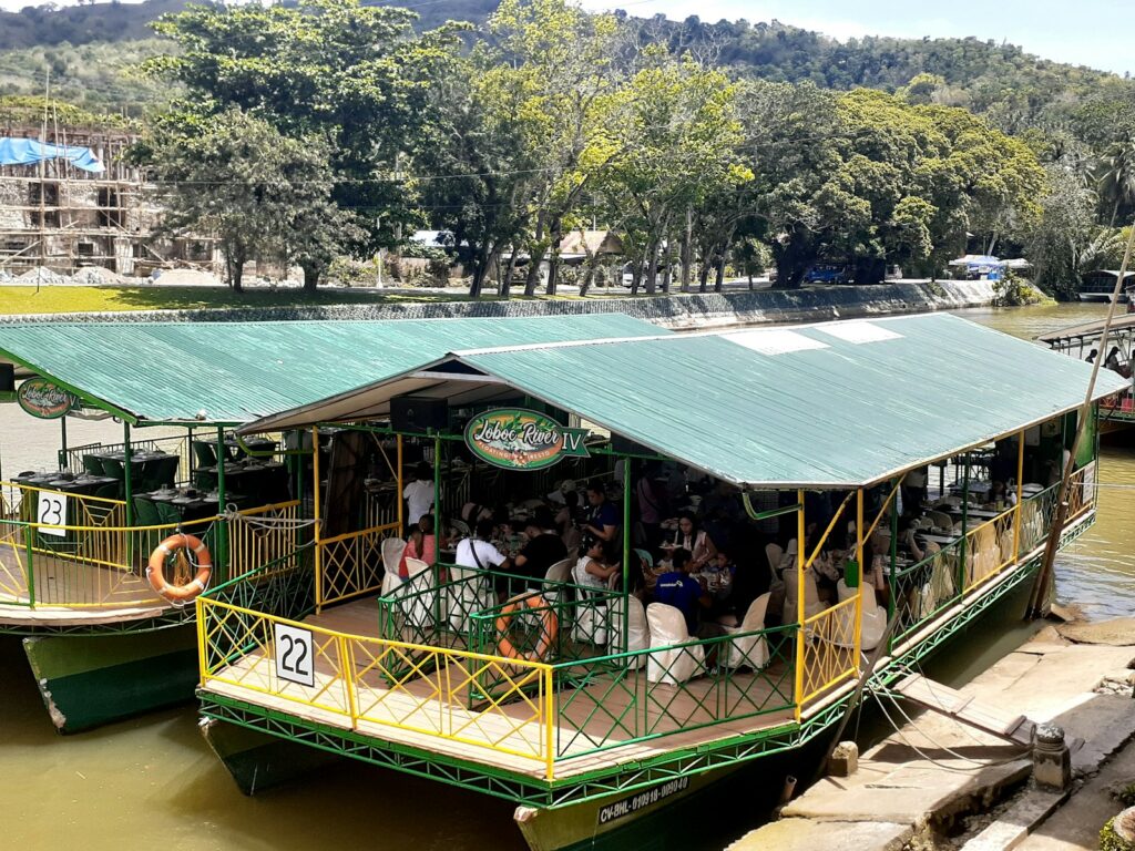 a group of people on a boat in a body of water