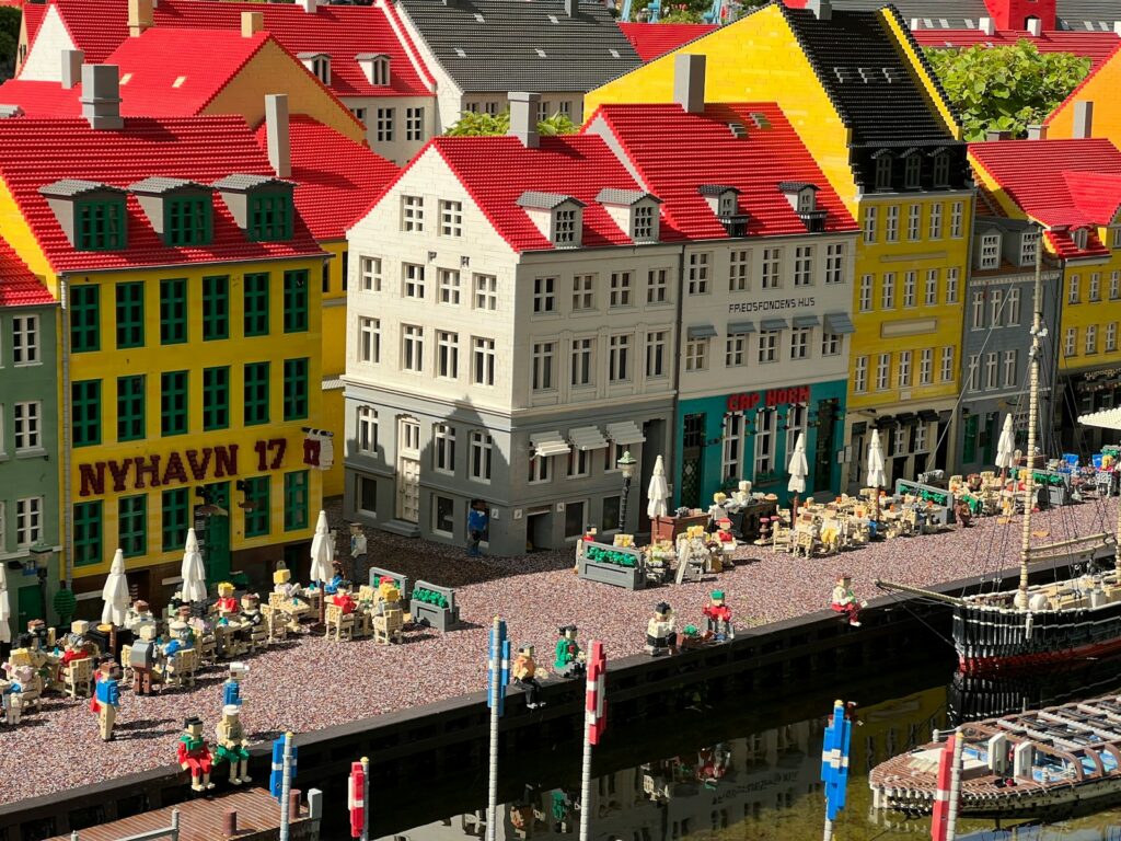 a group of buildings with people walking around