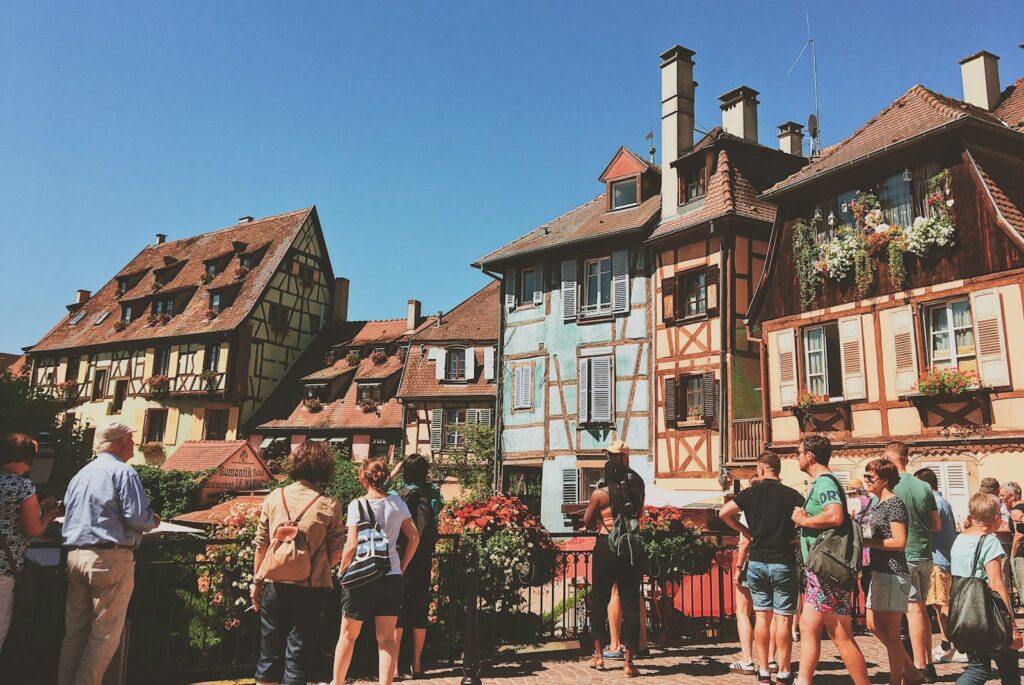 A group of people standing in front of a building