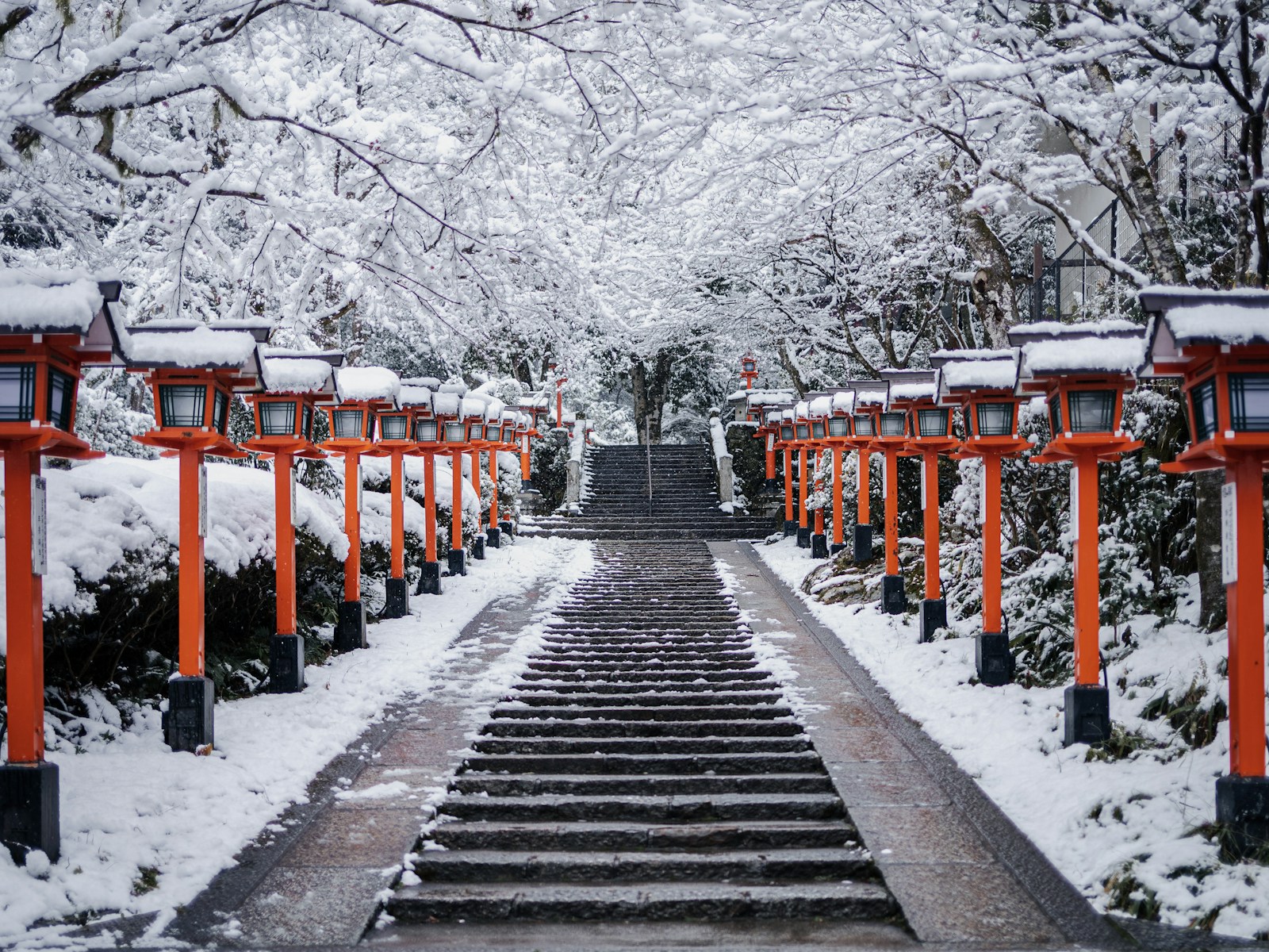 A long walkway with lots of snow on it